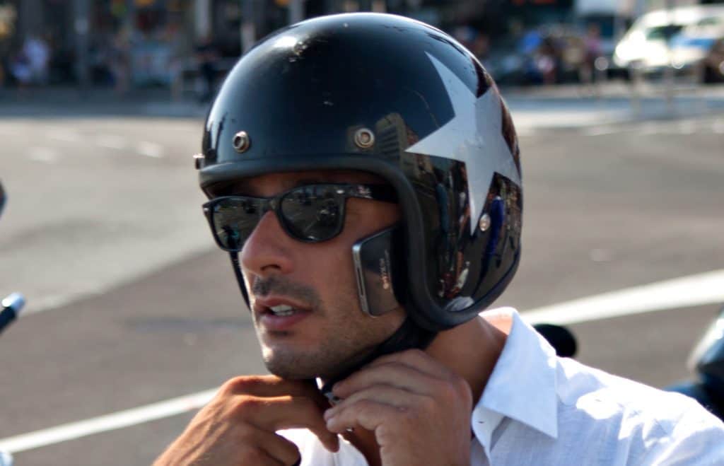 Open face helmet on a rider