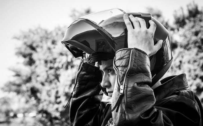 motorcyclist wearing a flip face helmet