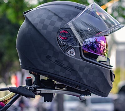 helmet hanging on handlebars