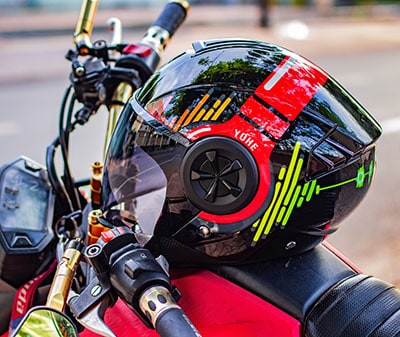 helmet sitting on a gas tank